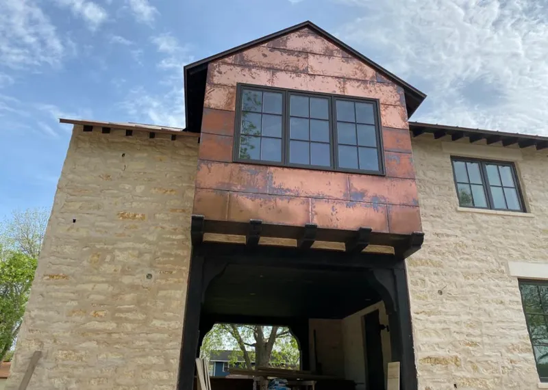 Copper metal panel facade on a stone building for Roof Repair in Las Vegas